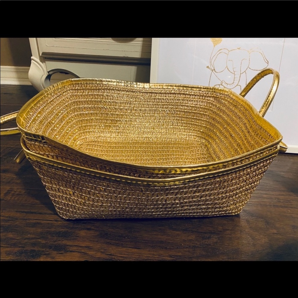 Two gold woven baskets.